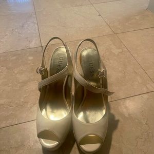 Guess white pumps